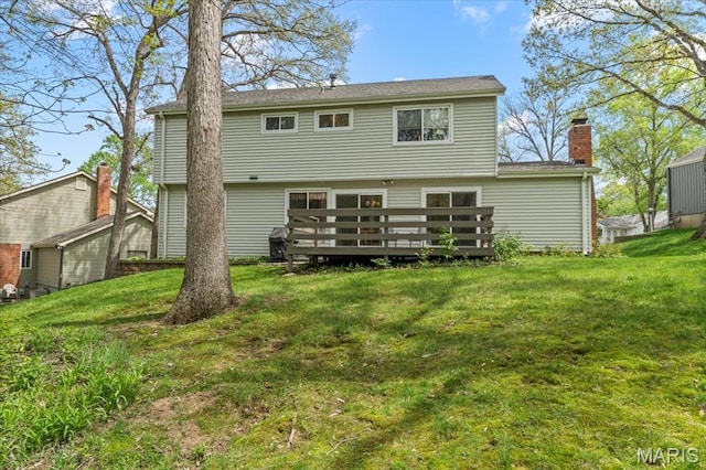 889 Almond Hill Ct, Manchester, MO 63021 - back of house with a wooden deck, a lawn, and a chimney