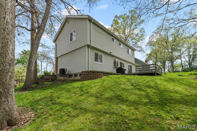 889 Almond Hill Ct, Manchester, MO 63021 - back of house featuring a lawn, a deck, and central AC unit