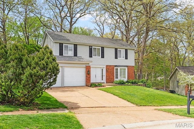889 Almond Hill Ct, Manchester, MO 63021 - view of front of home featuring concrete driveway, brick siding, a garage, and a front lawn
