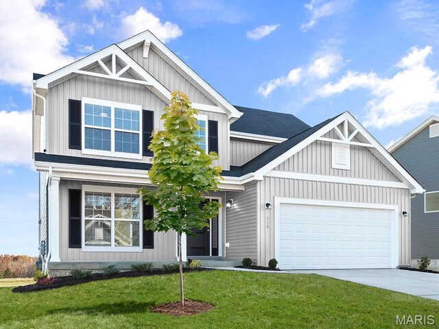 4145 Bear Ridge Dr, House Springs, MO 63051 - view of front of home featuring concrete driveway, a garage, a front lawn, and board and batten siding