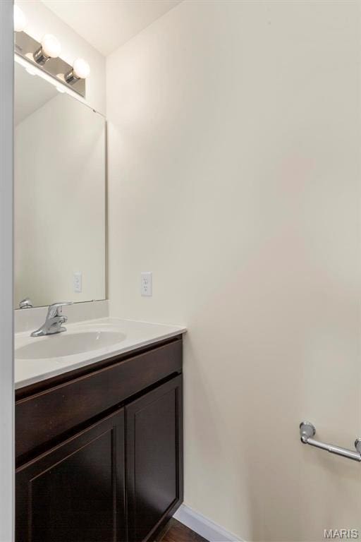 4145 Bear Ridge Dr, House Springs, MO 63051 - bathroom with vanity, baseboards, and wood finished floors