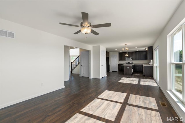 4145 Bear Ridge Dr, House Springs, MO 63051 - unfurnished living room featuring a sink, dark wood finished floors, baseboards, and a ceiling fan