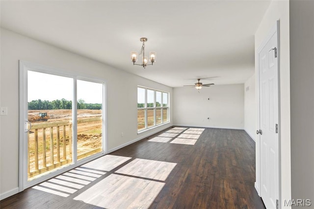 4145 Bear Ridge Dr, House Springs, MO 63051 - spare room with a chandelier, dark wood-style flooring, baseboards, and a ceiling fan