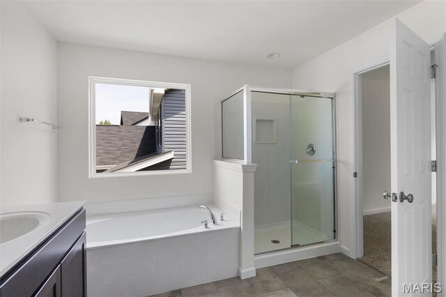 4145 Bear Ridge Dr, House Springs, MO 63051 - bathroom featuring a shower stall, a garden tub, and vanity