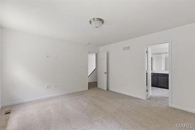 4145 Bear Ridge Dr, House Springs, MO 63051 - unfurnished bedroom featuring light colored carpet, baseboards, and ensuite bathroom