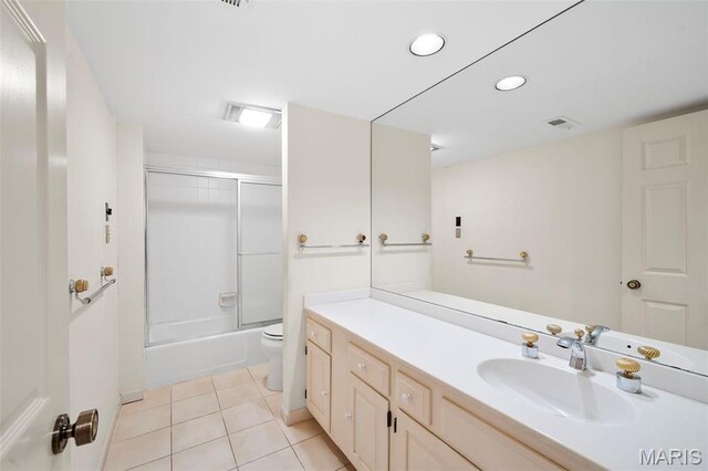 303 N Meramec Ave Unit 202, Saint Louis, MO 63105 - bathroom featuring vanity, toilet, tile patterned flooring, combined bath / shower with glass door, and recessed lighting