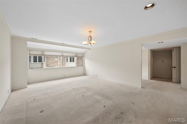 303 N Meramec Ave Unit 202, Saint Louis, MO 63105 - empty room featuring ornamental molding, carpet flooring, a chandelier, and baseboards