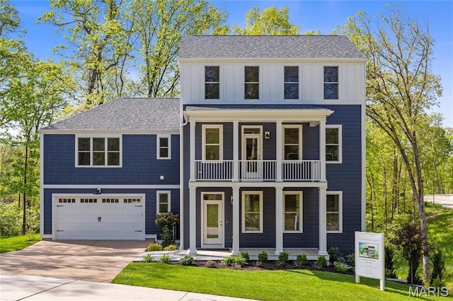 modern farmhouse style home featuring a balcony, covered porch, board and batten siding, driveway, and a garage