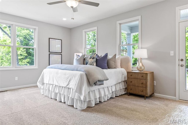 bedroom with multiple windows and baseboards