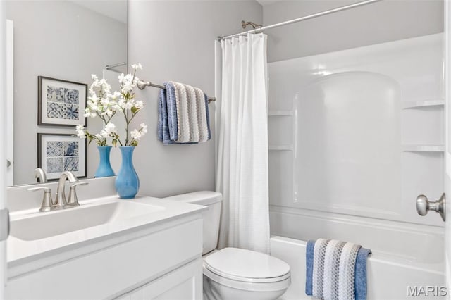 full bath featuring toilet, shower / bath combo, and vanity