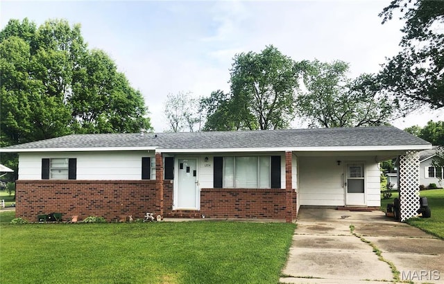 1204 W Grant St, Dexter, MO 63841 - ranch-style home featuring concrete driveway, brick siding, a front lawn, and a carport