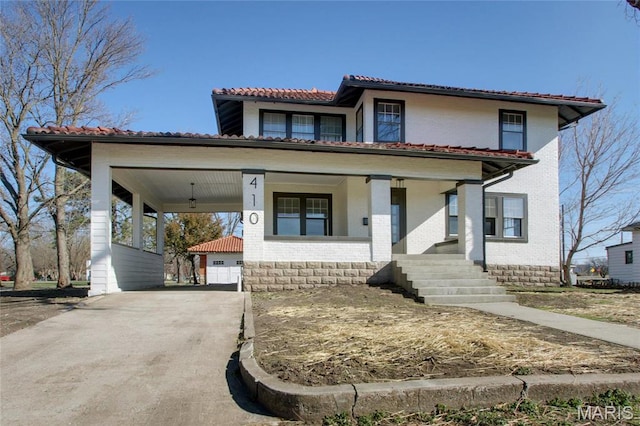 410 White St, Canton, MO 63435 - view of front facade with brick siding, a tile roof, covered porch, and driveway