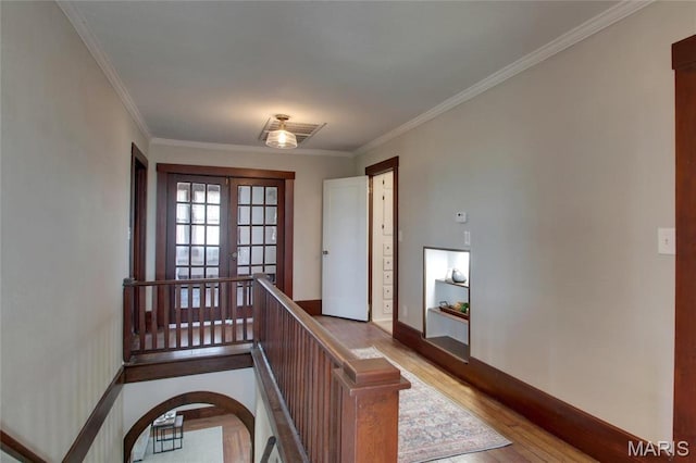 410 White St, Canton, MO 63435 - foyer with wood finished floors, crown molding, french doors, and baseboards