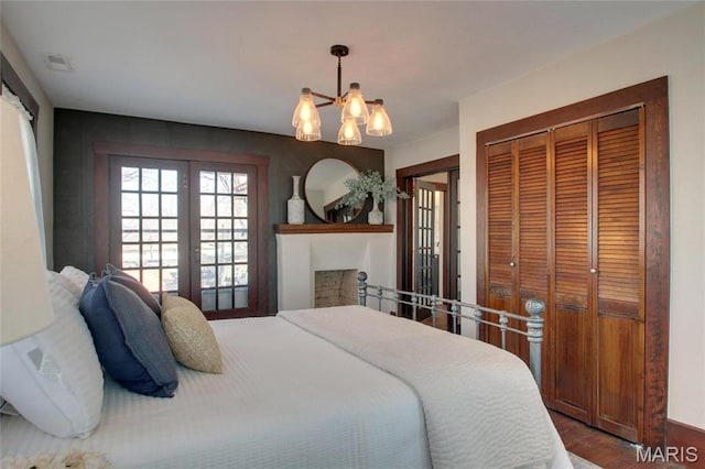 410 White St, Canton, MO 63435 - bedroom with french doors, a chandelier, and wood finished floors