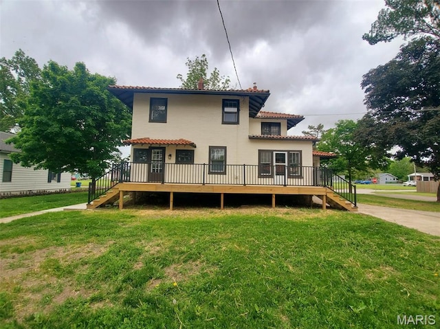 410 White St, Canton, MO 63435 - back of house with stairs, a tiled roof, a wooden deck, and a yard