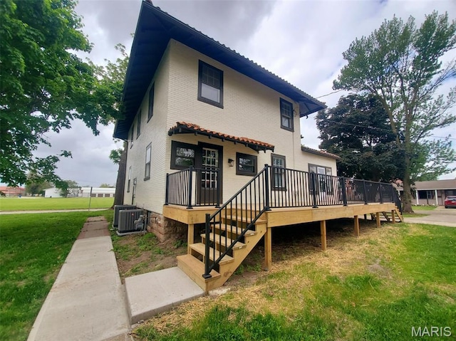 410 White St, Canton, MO 63435 - view of front of house with a front lawn, central air condition unit, and a wooden deck