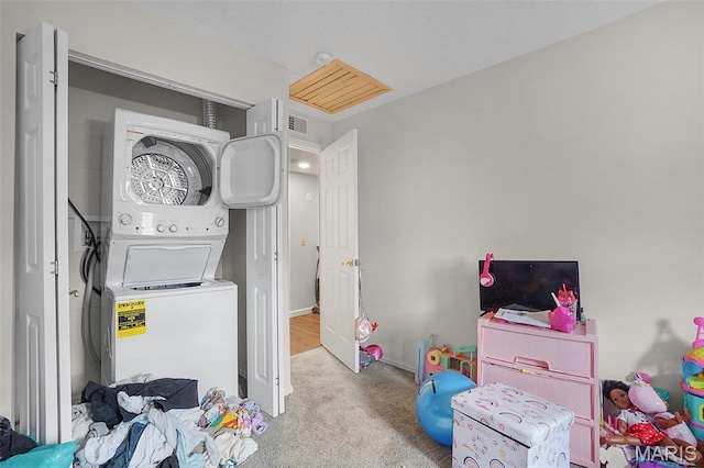 80 Lemans Ct Unit 80, Lake St Louis, MO 63367 - washroom featuring stacked washing machine and dryer and carpet floors