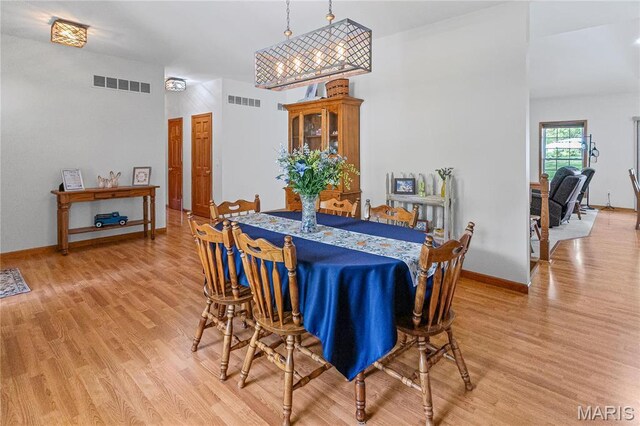 1302 Walnut St, Jerseyville, IL 62052 - dining room featuring light wood-type flooring and baseboards