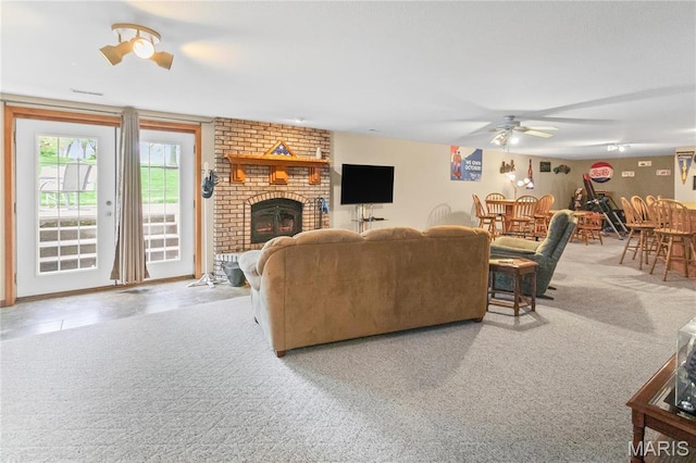 1302 Walnut St, Jerseyville, IL 62052 - carpeted living area featuring ceiling fan and a fireplace