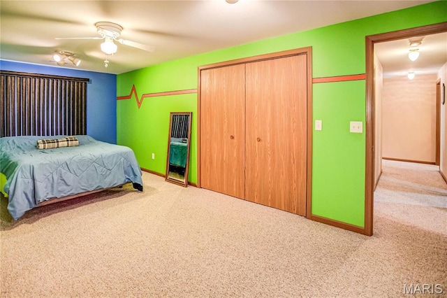 1302 Walnut St, Jerseyville, IL 62052 - carpeted bedroom with a closet, baseboards, and ceiling fan