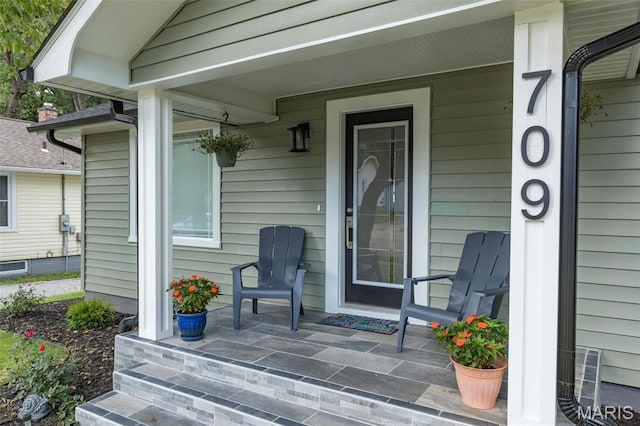 709 Warren St, Farmington, MO 63640 - view of exterior entry featuring covered porch