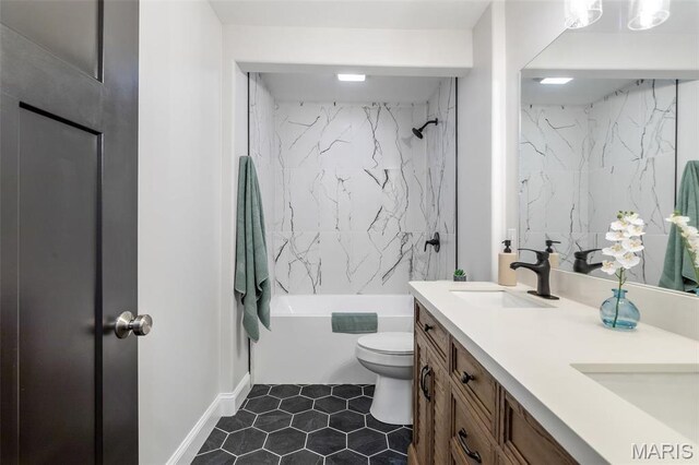709 Warren St, Farmington, MO 63640 - full bath featuring toilet, double vanity, tile patterned flooring, and shower / bath combination