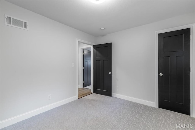709 Warren St, Farmington, MO 63640 - unfurnished bedroom with baseboards and carpet floors