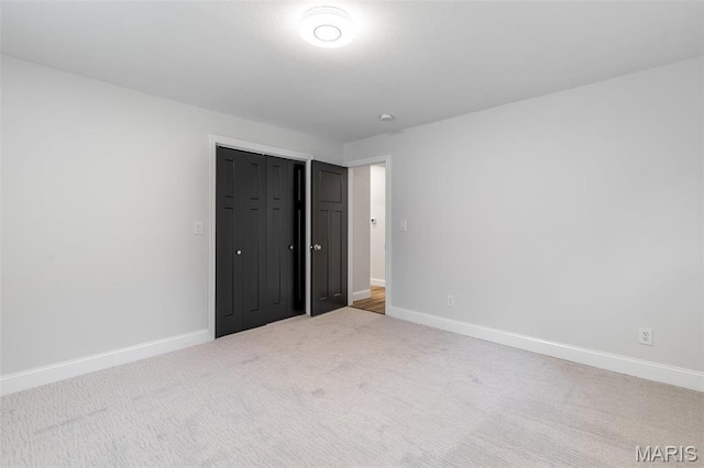 709 Warren St, Farmington, MO 63640 - unfurnished bedroom featuring carpet floors, baseboards, and a closet