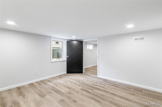 709 Warren St, Farmington, MO 63640 - below grade area with light wood-style floors, baseboards, and recessed lighting
