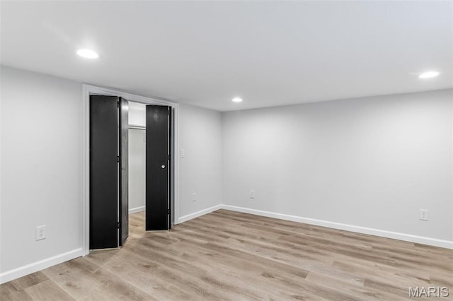 709 Warren St, Farmington, MO 63640 - unfurnished bedroom with recessed lighting, light wood-style floors, baseboards, and a spacious closet