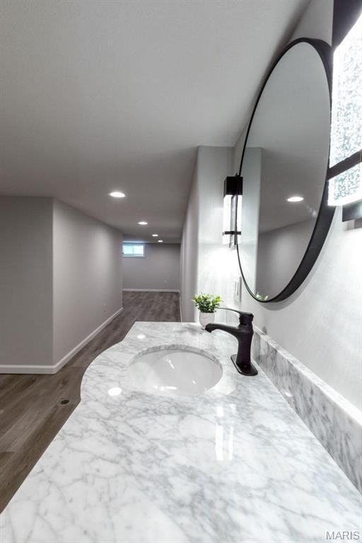 709 Warren St, Farmington, MO 63640 - bathroom with a sink, recessed lighting, and wood finished floors