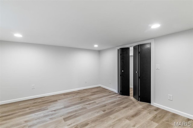 709 Warren St, Farmington, MO 63640 - finished basement featuring recessed lighting, wood finished floors, and baseboards