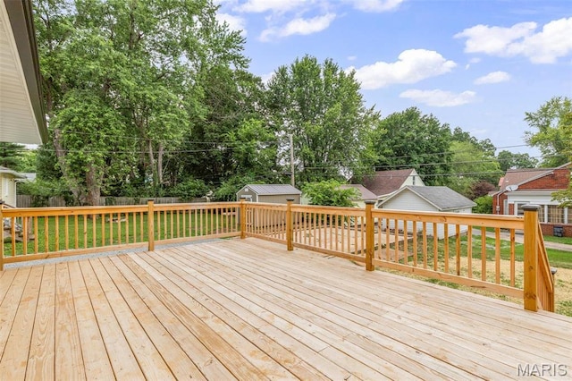 709 Warren St, Farmington, MO 63640 - wooden terrace featuring an outdoor structure and a storage unit