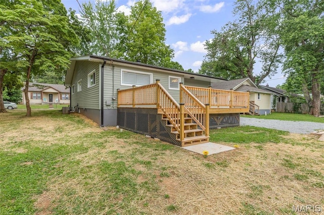 709 Warren St, Farmington, MO 63640 - back of property featuring a wooden deck and stairway