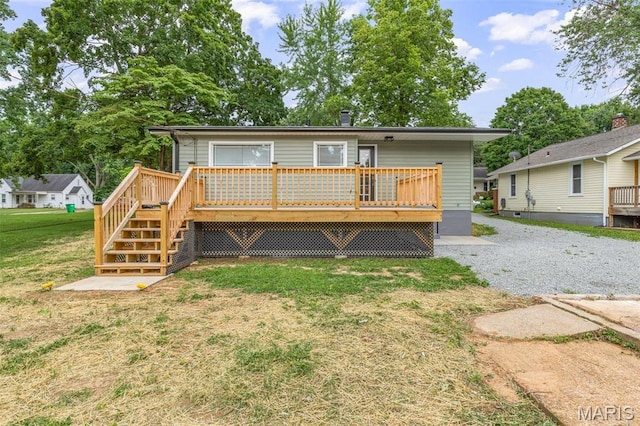 709 Warren St, Farmington, MO 63640 - back of house featuring a wooden deck, a lawn, and stairs