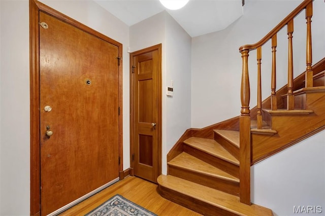 7423 Tulane Ave, Saint Louis, MO 63130 - foyer featuring light wood finished floors and stairway