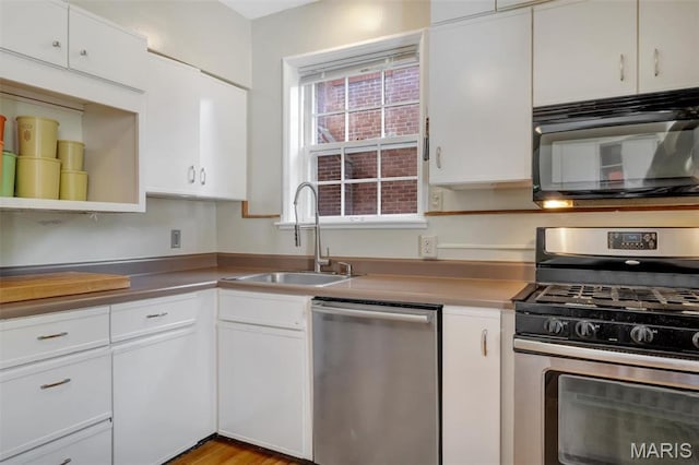 7423 Tulane Ave, Saint Louis, MO 63130 - kitchen featuring appliances with stainless steel finishes and white cabinetry