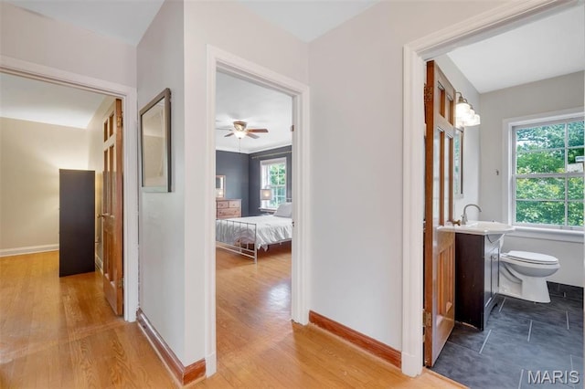 7423 Tulane Ave, Saint Louis, MO 63130 - hallway with baseboards and wood finished floors