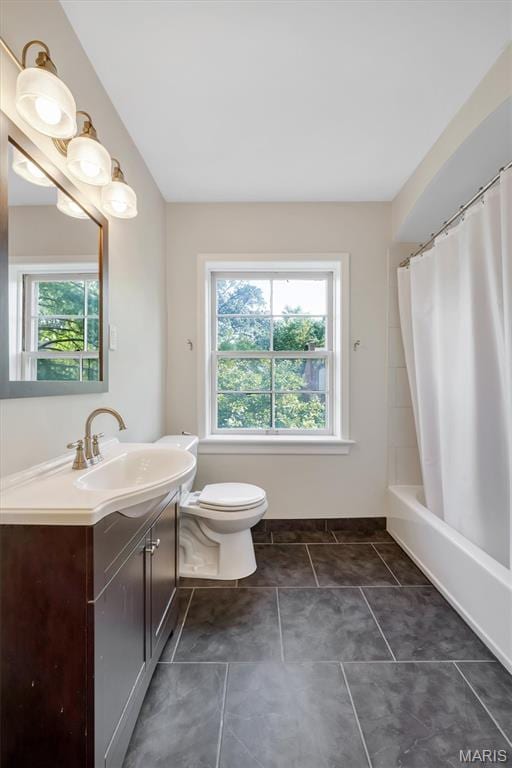 7423 Tulane Ave, Saint Louis, MO 63130 - full bath featuring healthy amount of natural light, vanity, shower / bath combo with shower curtain, and tile patterned floors