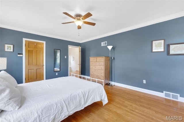 7423 Tulane Ave, Saint Louis, MO 63130 - bedroom featuring wood finished floors, crown molding, and ceiling fan