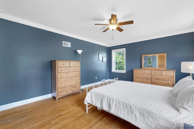 7423 Tulane Ave, Saint Louis, MO 63130 - bedroom featuring crown molding, wood finished floors, and ceiling fan