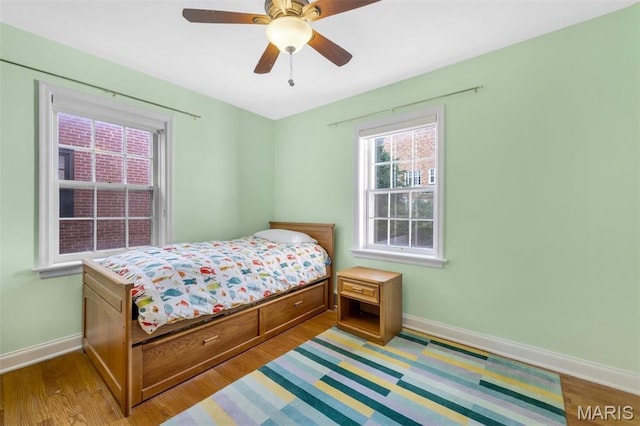 7423 Tulane Ave, Saint Louis, MO 63130 - bedroom featuring wood finished floors and a ceiling fan