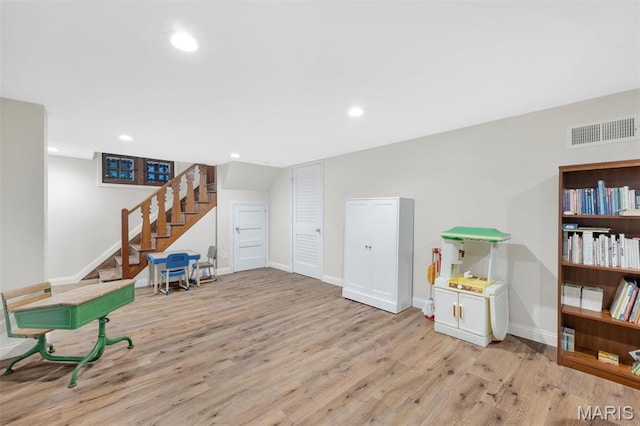 7423 Tulane Ave, Saint Louis, MO 63130 - sitting room featuring stairs, wood finished floors, and recessed lighting