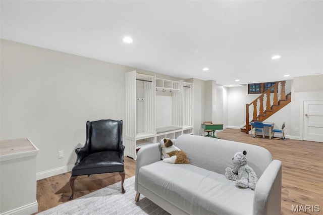 7423 Tulane Ave, Saint Louis, MO 63130 - living area featuring stairs, wood finished floors, and recessed lighting