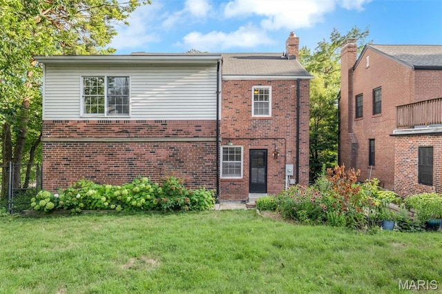 7423 Tulane Ave, Saint Louis, MO 63130 - view of front of home featuring brick siding and a chimney