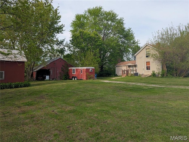 8777 State Route 162, Troy, IL 62294 - view of grassy yard featuring an outbuilding and cooling unit