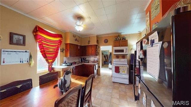 8777 State Route 162, Troy, IL 62294 - kitchen featuring white appliances, light countertops, and light floors