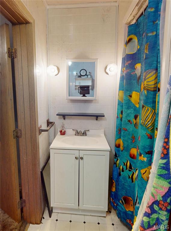 8777 State Route 162, Troy, IL 62294 - full bathroom featuring vanity, tile patterned floors, and a shower with shower curtain