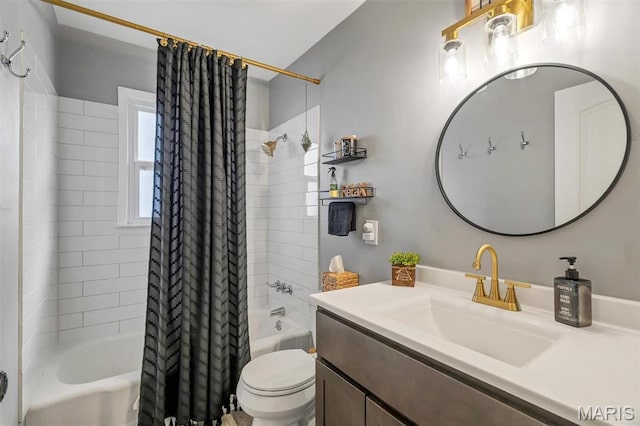 full bathroom featuring shower / bath combo with shower curtain, toilet, and vanity