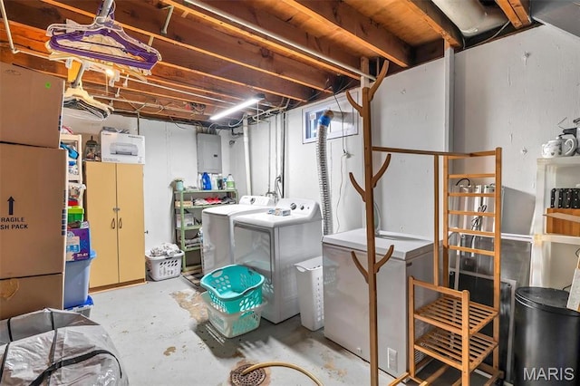 unfinished basement with washing machine and dryer and fridge